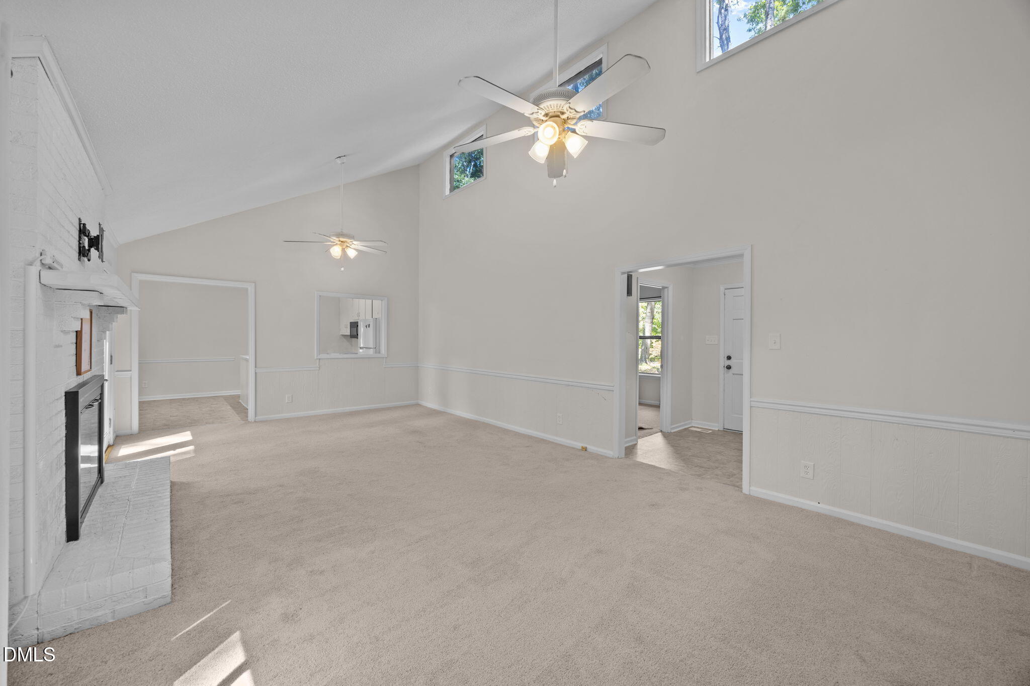 904 Snow Hill Road Durham, NC 27712 - Photo 13 of 41 a view of an empty room with a chandelier