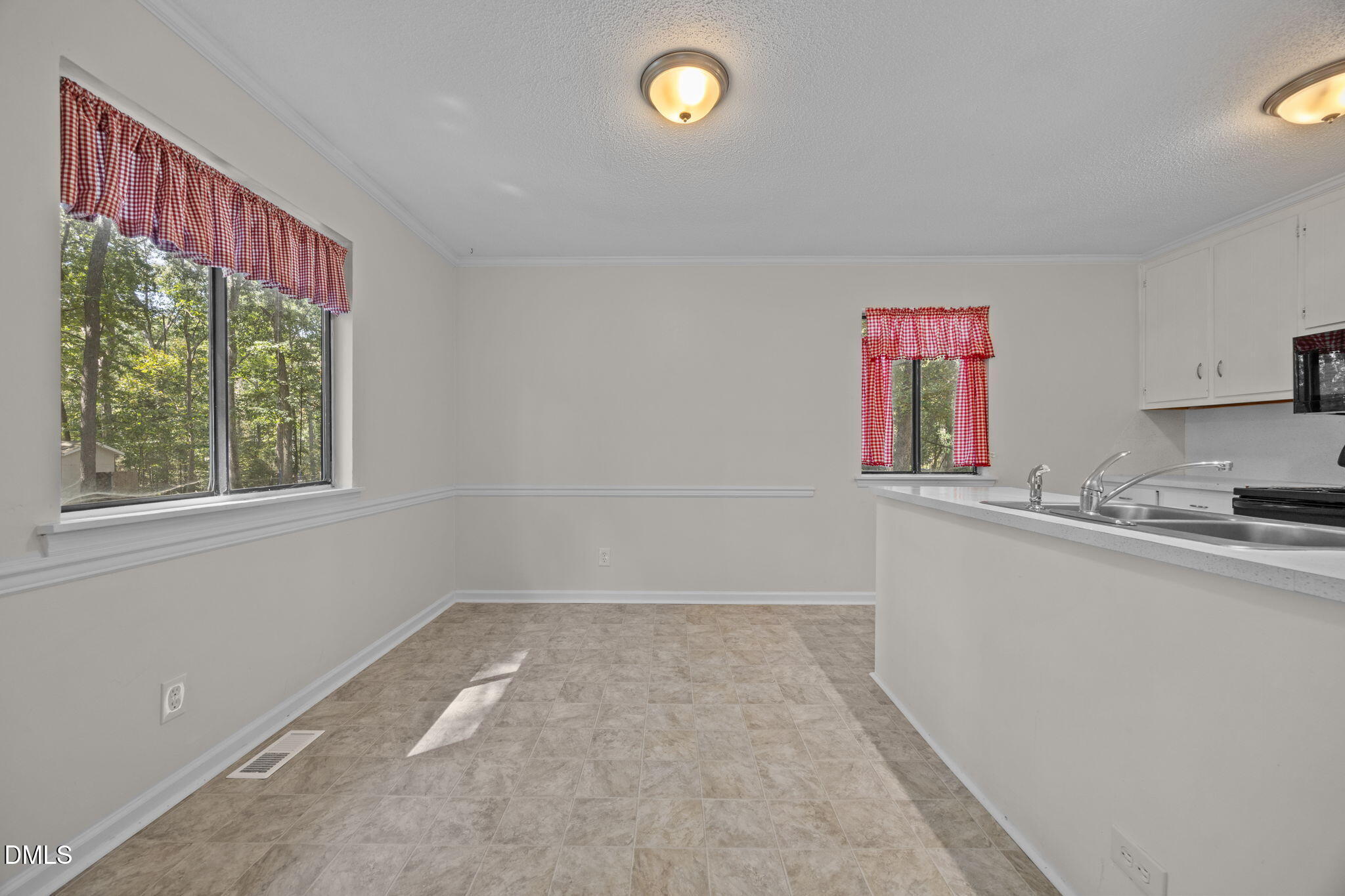 904 Snow Hill Road Durham, NC 27712 - Photo 18 of 41 a bathroom with a sink and a mirror