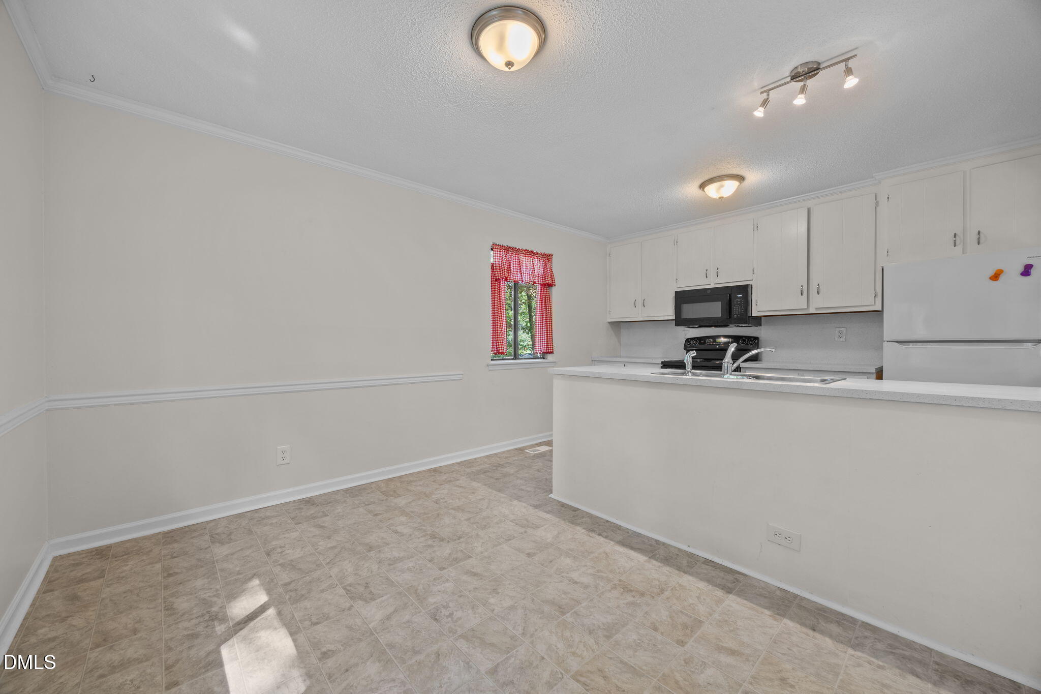 904 Snow Hill Road Durham, NC 27712 - Photo 19 of 41 a view of cabinets and window