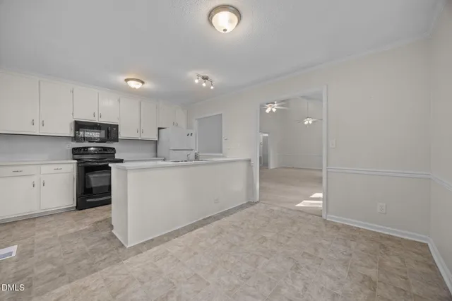 a view of a kitchen with electric appliances