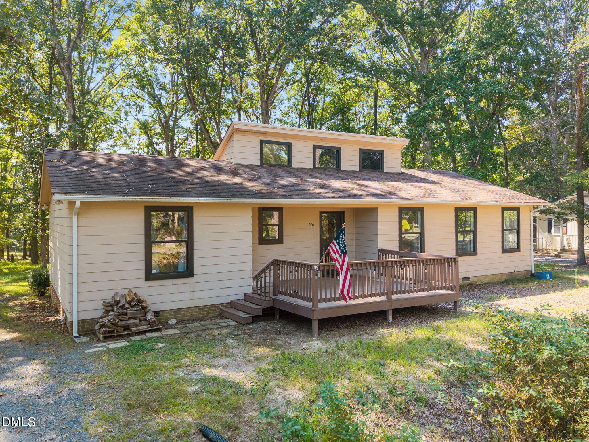 904 Snow Hill Road Durham, NC 27712 - Photo 2 of 41 a view of house with a yard outdoor seating and deck
