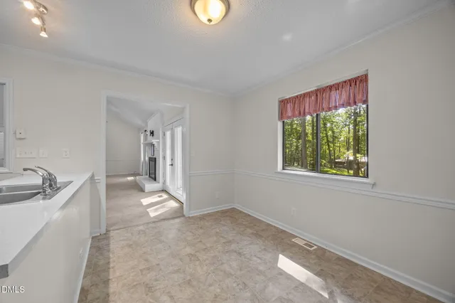 a view of a kitchen and a sink washer and entryway