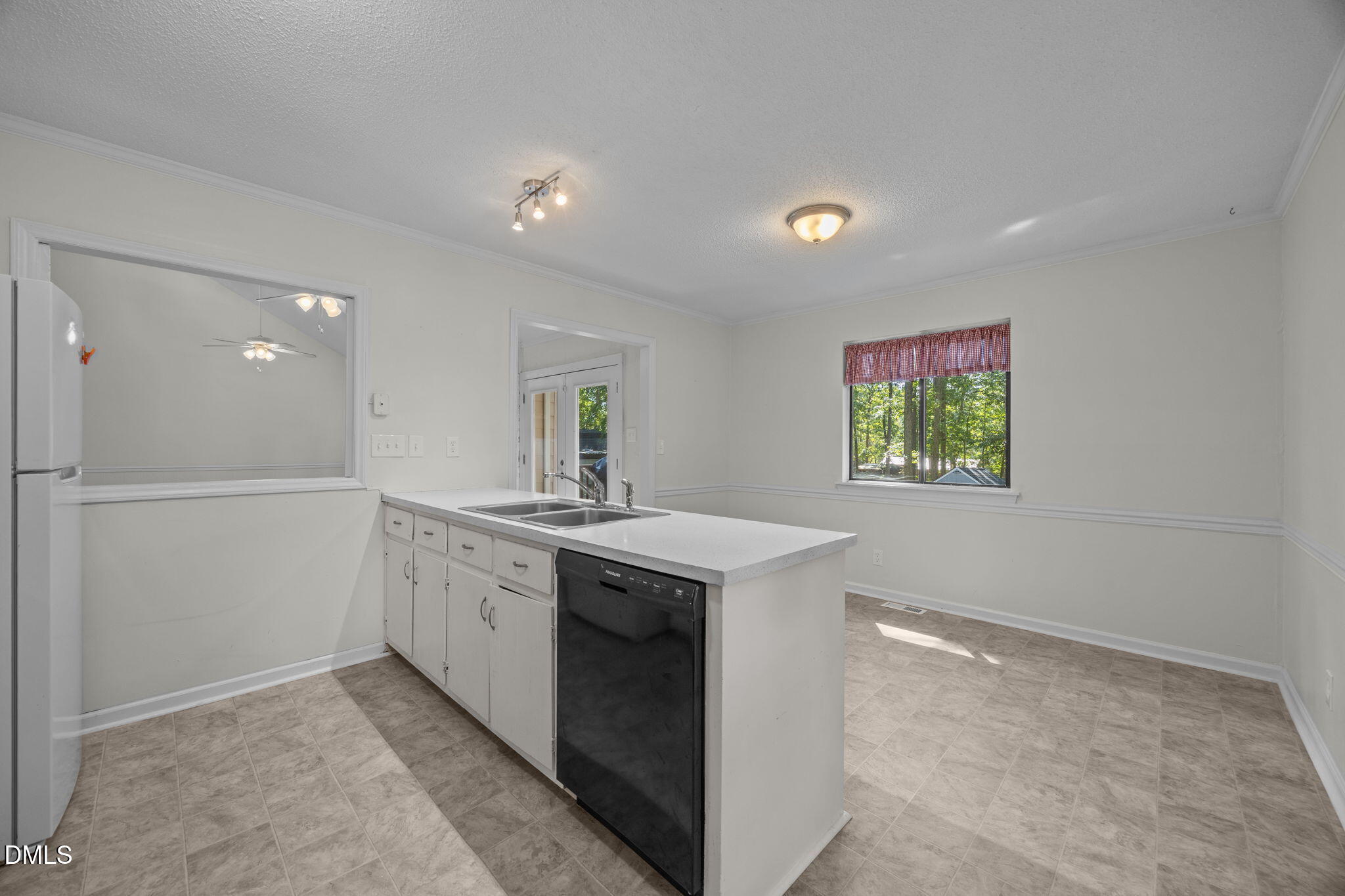 904 Snow Hill Road Durham, NC 27712 - Photo 22 of 41 a kitchen with a sink and a stove top oven