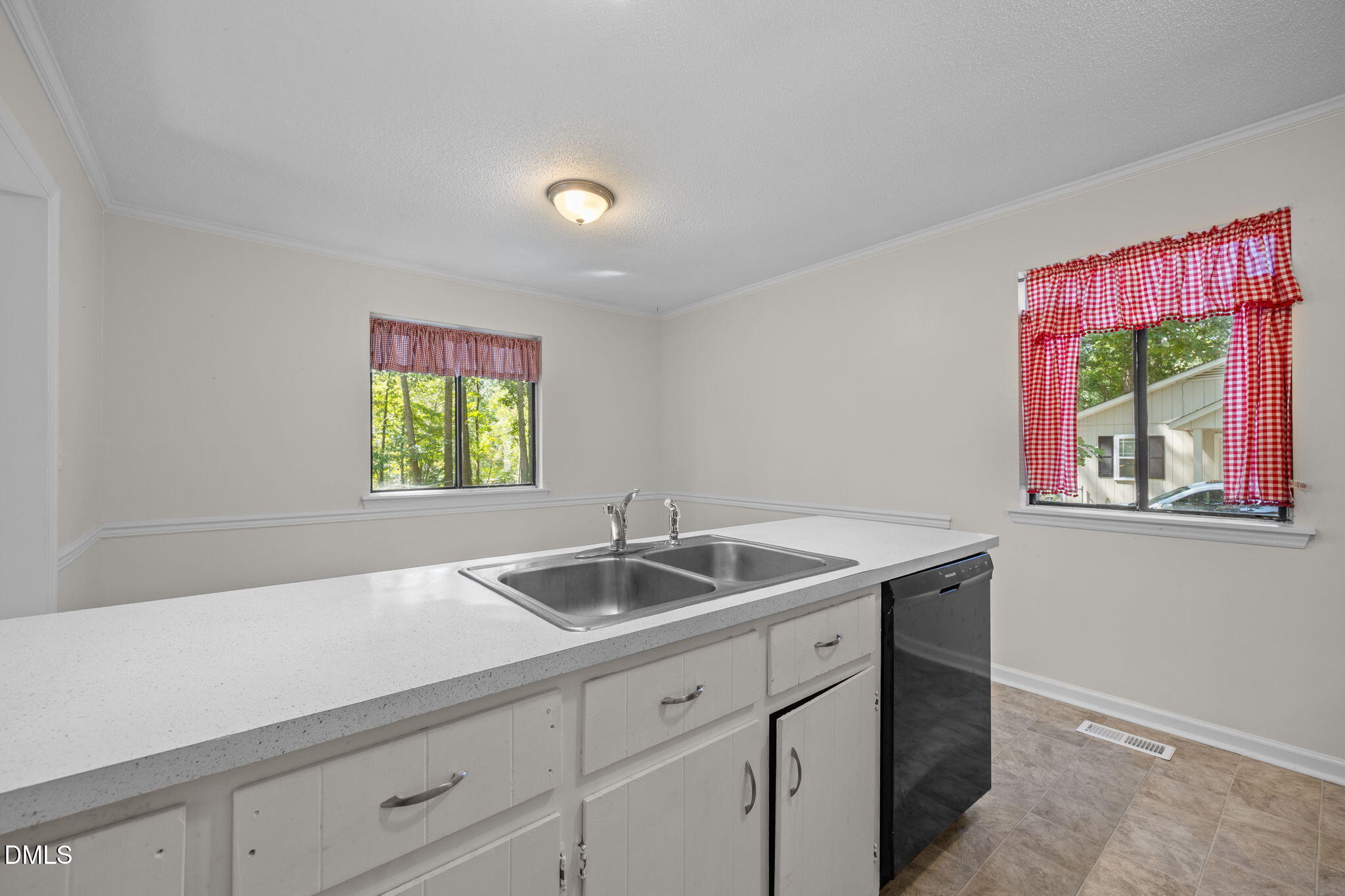 904 Snow Hill Road Durham, NC 27712 - Photo 25 of 41 a kitchen with a sink and a window