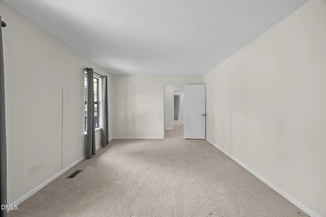 a view of empty room with closet
