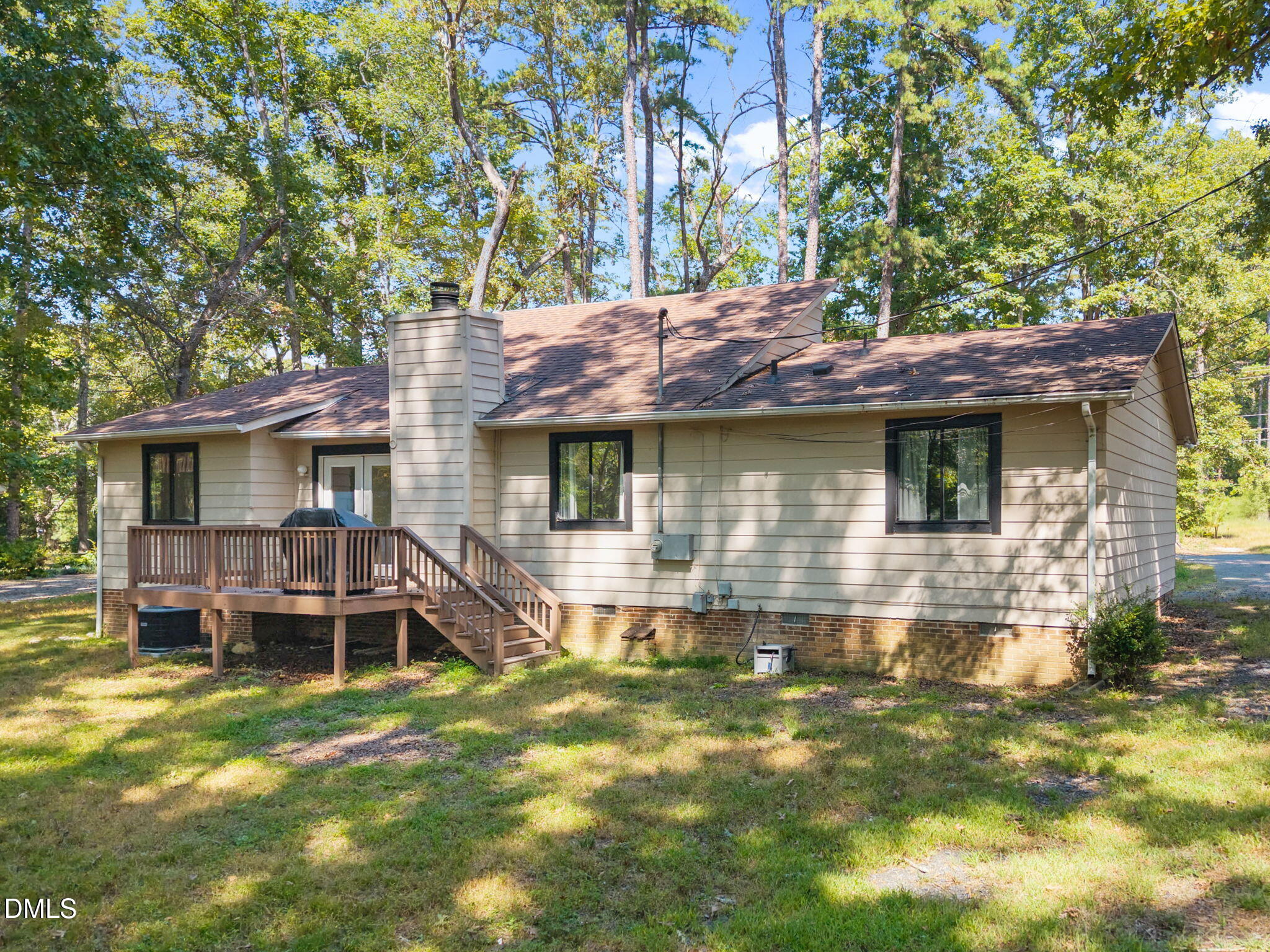 904 Snow Hill Road Durham, NC 27712 - Photo 3 of 41 a front view of a house with a yard glass top table and chairs