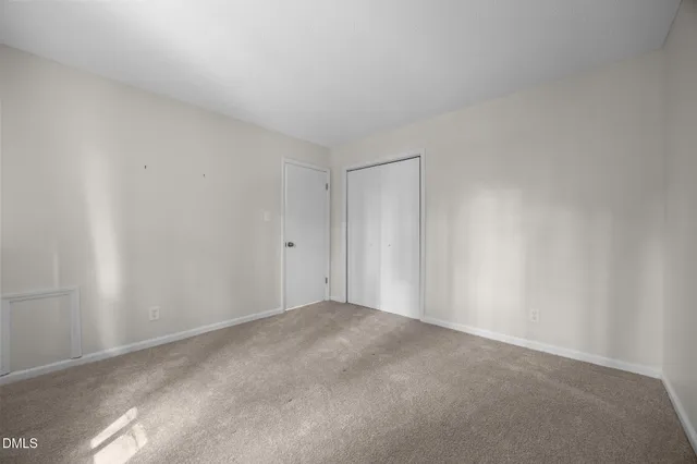 a view of an empty room and entryway
