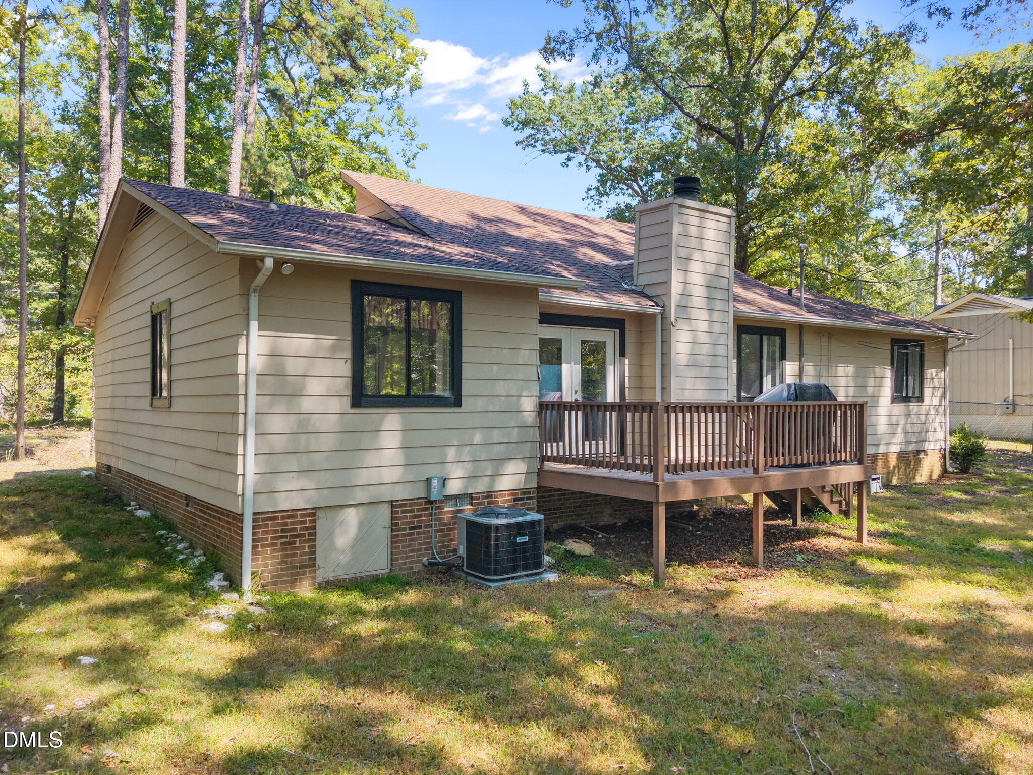 904 Snow Hill Road Durham, NC 27712 - Photo 5 of 41 a backyard of a house with table and chairs