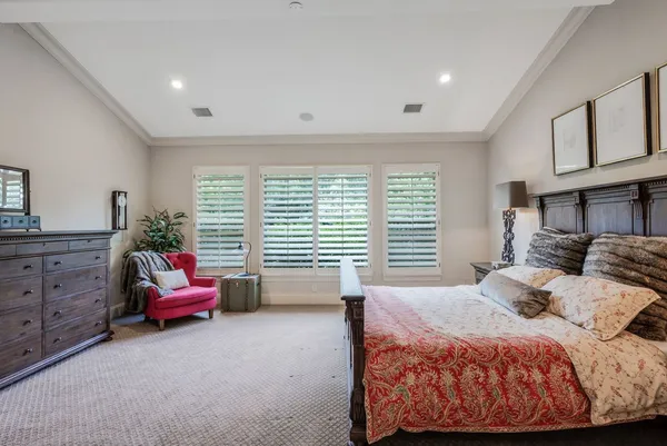 a bedroom with a bed and furniture