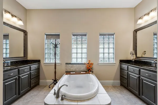 a kitchen with a stove a sink and a window