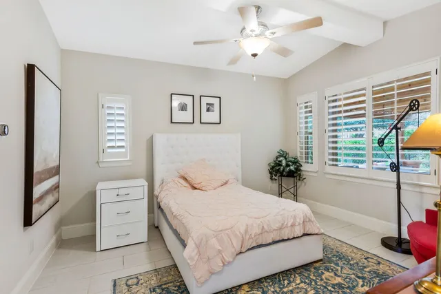 a bedroom with bed and dresser