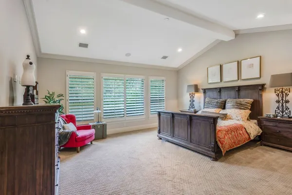 a bedroom with bed and window