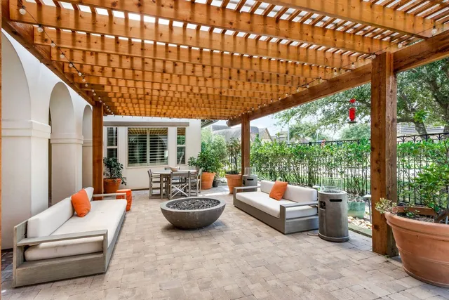 a outdoor space with patio couches and potted plants
