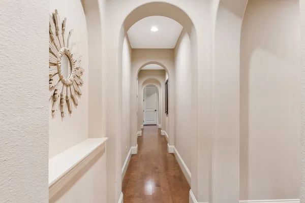 a view of a hallway with a white door