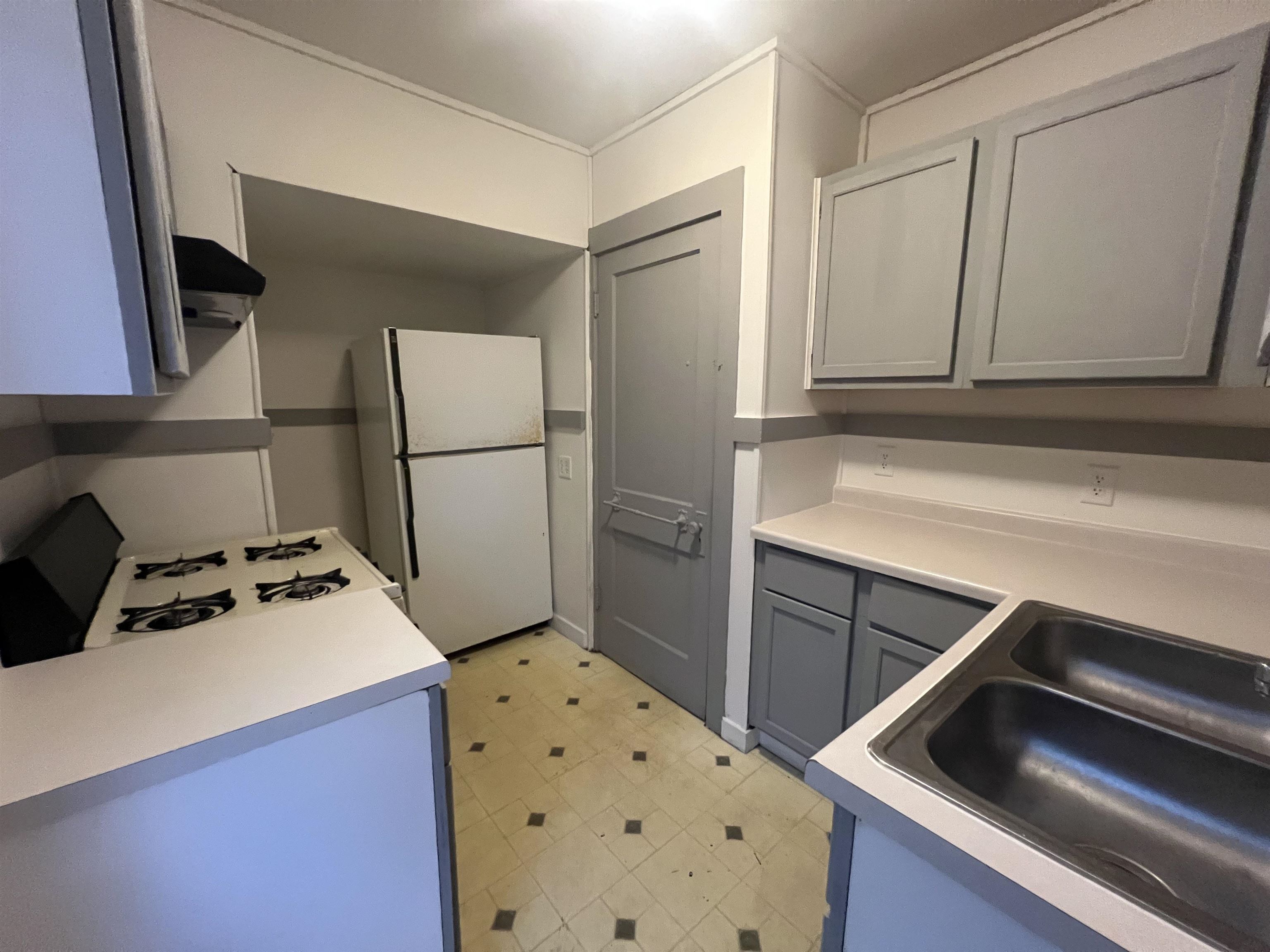 312 North Johnston Avenue Rockford, IL 61101 - Photo 6 of 14 a kitchen with a refrigerator sink and stove