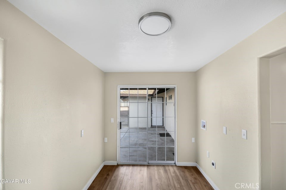 45503 11th Street West Lancaster, CA 93534 - Photo 11 of 37 a view of a hallway with wooden floor