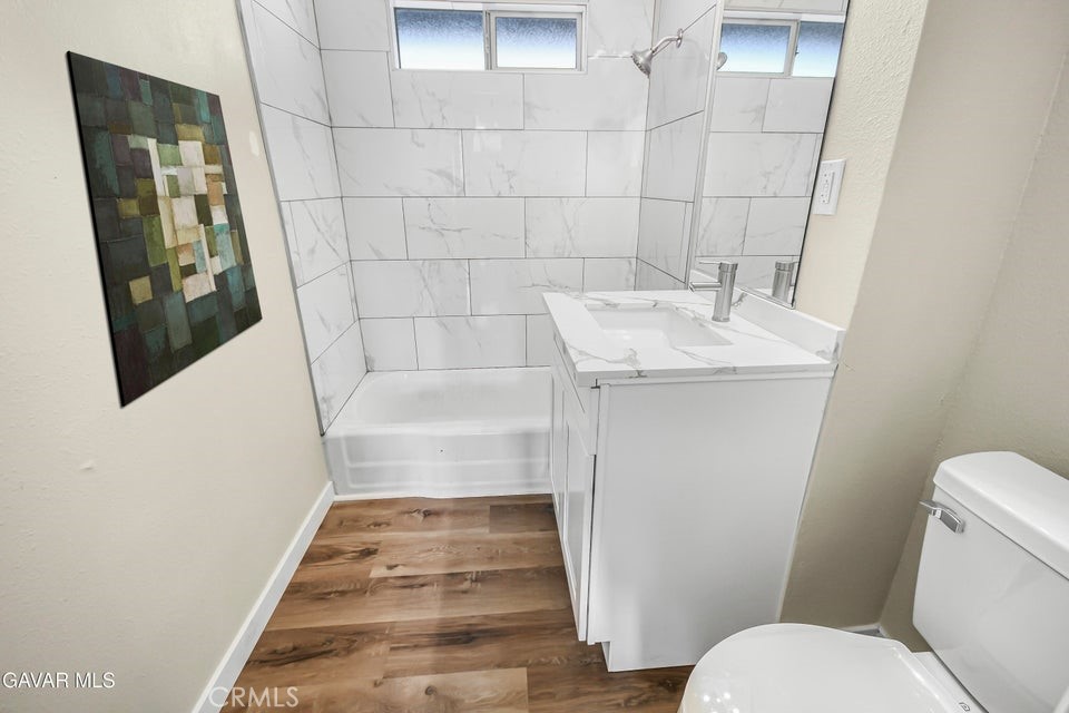 45503 11th Street West Lancaster, CA 93534 - Photo 12 of 37 a bathroom with a sink and toilet