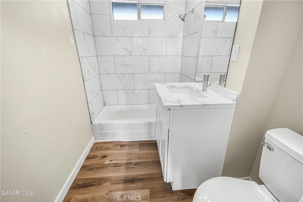 45503 11th Street West Lancaster, CA 93534 - Photo 13 of 37 a bathroom with a sink and toilet