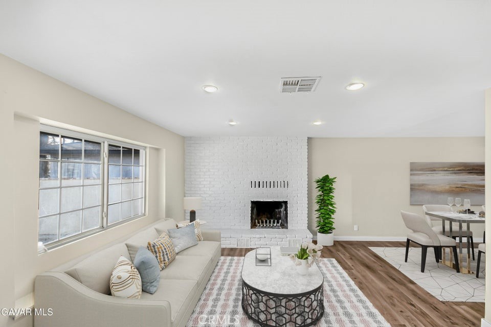 45503 11th Street West Lancaster, CA 93534 - Photo 2 of 37 a living room with furniture and a table
