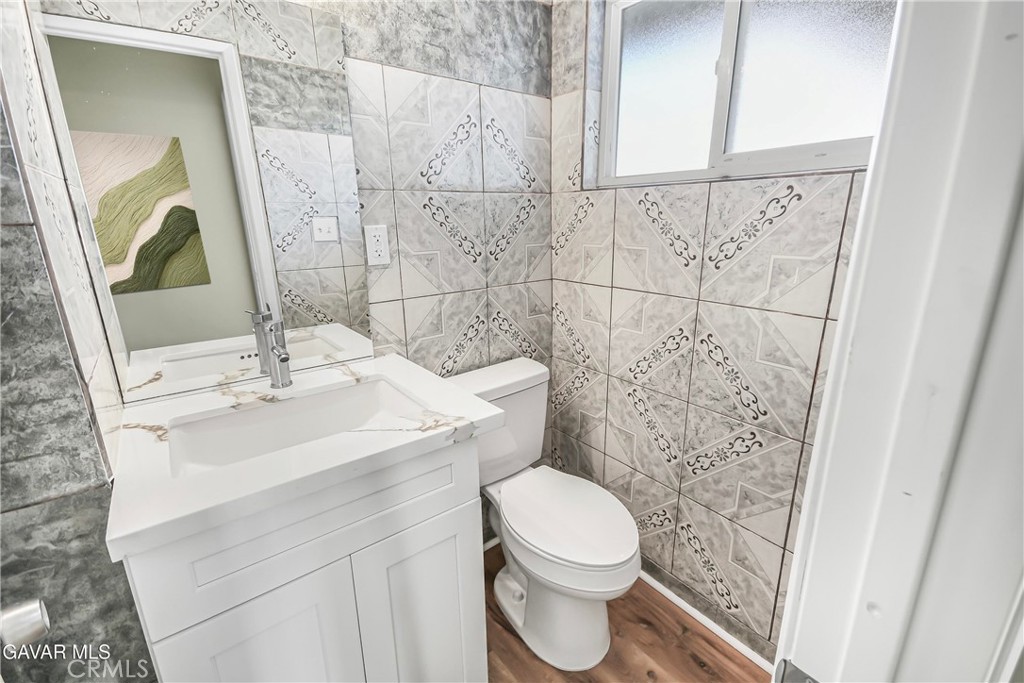 45503 11th Street West Lancaster, CA 93534 - Photo 24 of 37 a bathroom with a sink a toilet and shower