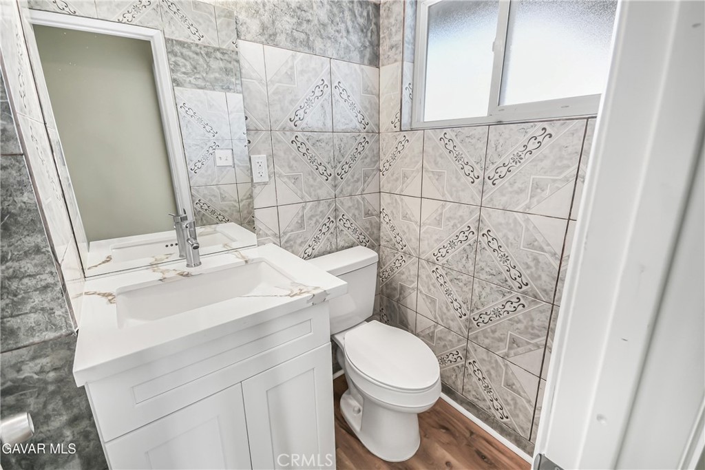 45503 11th Street West Lancaster, CA 93534 - Photo 25 of 37 a bathroom with a sink a toilet and shower