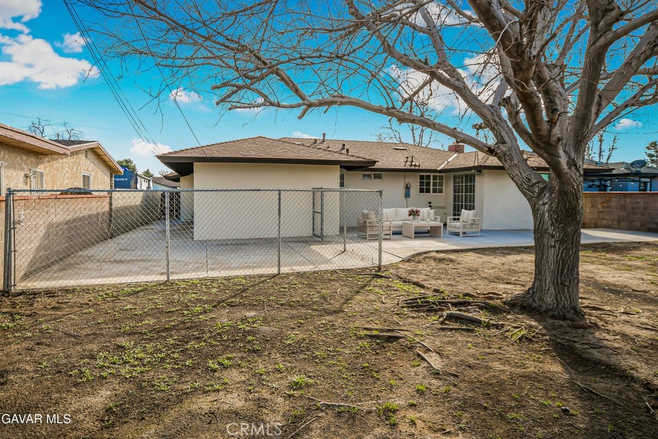 45503 11th Street West Lancaster, CA 93534 - Photo 36 of 37 a house that has a tree in front of it