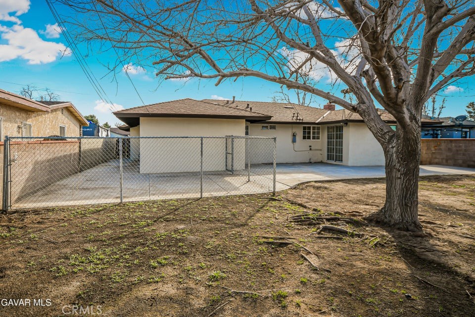 45503 11th Street West Lancaster, CA 93534 - Photo 37 of 37 a house that has a tree in front of it
