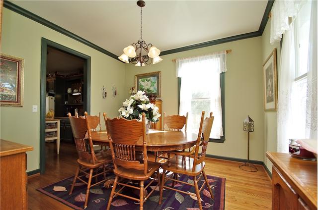 1125 Lewis Road Burns, TN 37029 - Photo 13 of 20 Dining room with crown molding & hardwood floors
