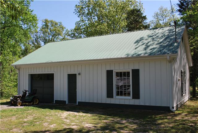 1125 Lewis Road Burns, TN 37029 - Photo 5 of 20 1200 sq. ft. detached garage/workshop with windows, garage door, pedestrian door, cabinets & storage loft