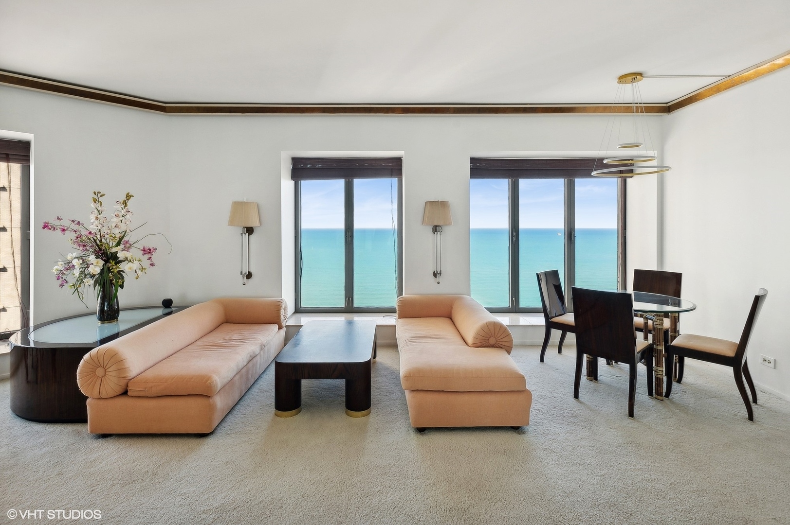 950 North Michigan Avenue, Unit 2203 Chicago, IL 60611 - Photo 11 of 26 a living room with furniture and a large window