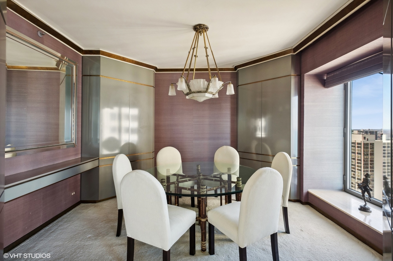 950 North Michigan Avenue, Unit 2203 Chicago, IL 60611 - Photo 15 of 26 a view of a dining room with furniture and windows