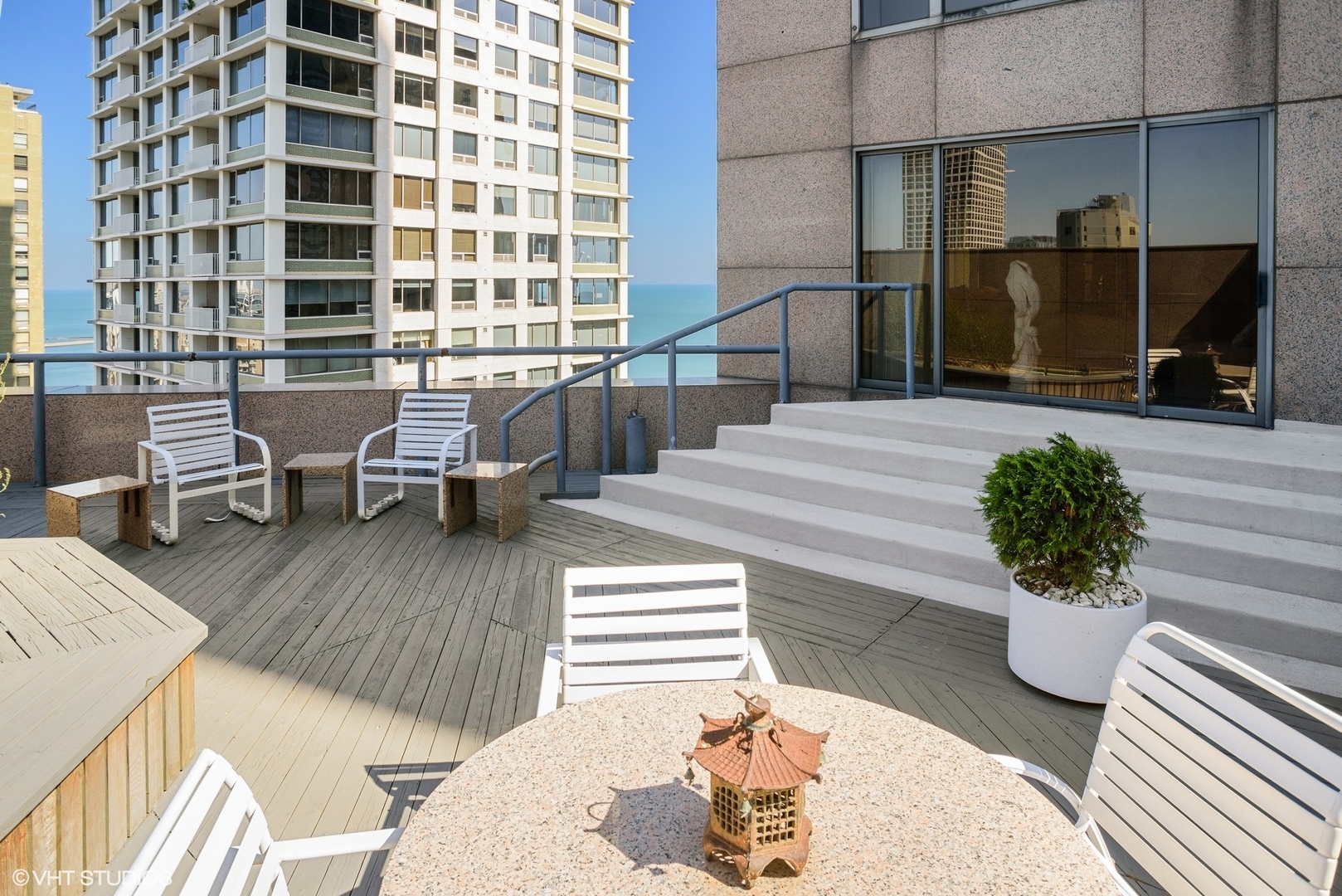 950 North Michigan Avenue, Unit 2203 Chicago, IL 60611 - Photo 2 of 26 a lobby with furniture and a potted plant