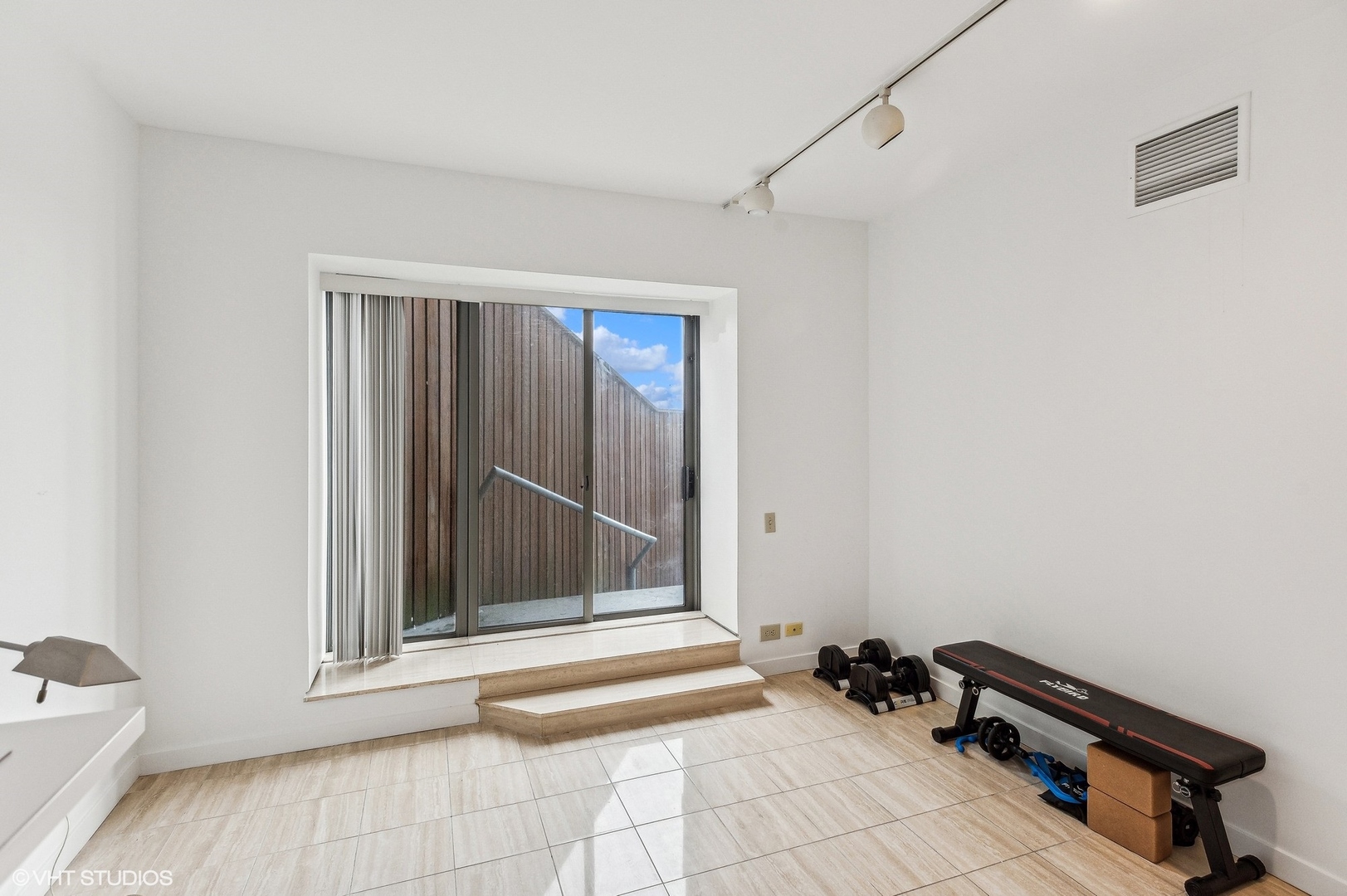 950 North Michigan Avenue, Unit 2203 Chicago, IL 60611 - Photo 23 of 26 a view of room with walk in closet and window