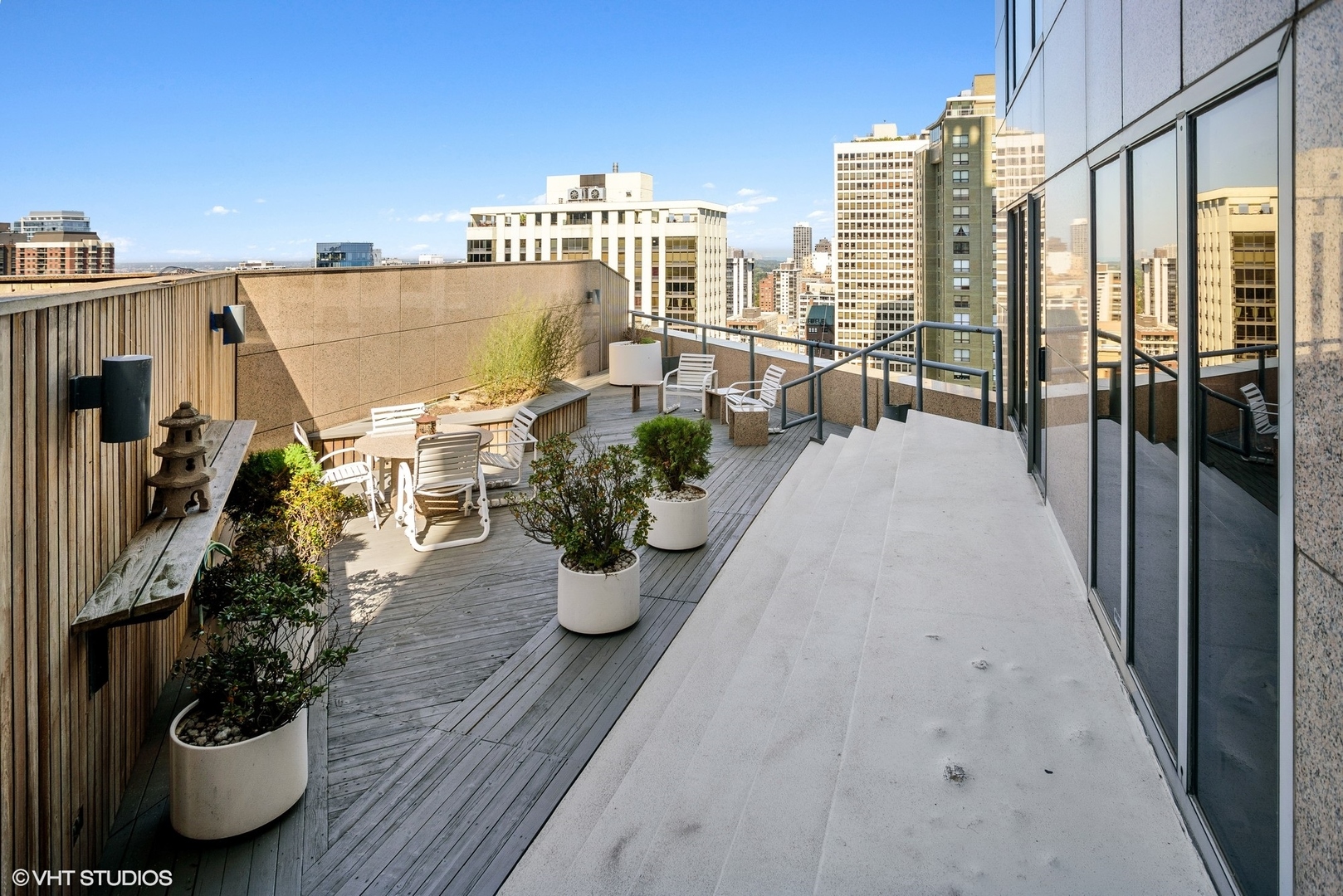 950 North Michigan Avenue, Unit 2203 Chicago, IL 60611 - Photo 24 of 26 a view of a balcony with potted plants