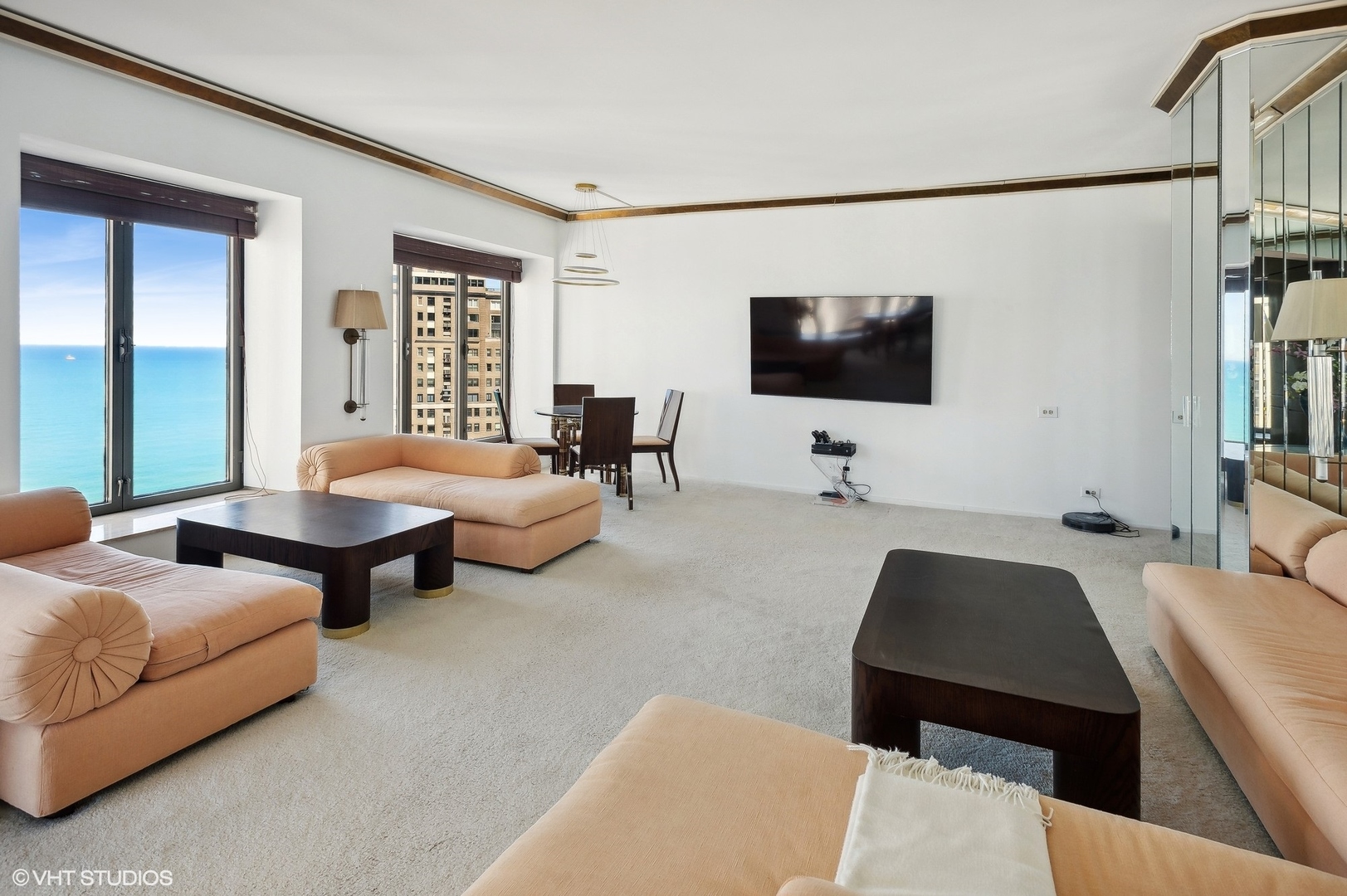 950 North Michigan Avenue, Unit 2203 Chicago, IL 60611 - Photo 10 of 26 a living room with furniture and a flat screen tv