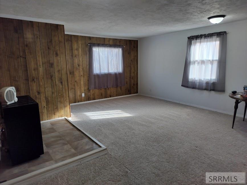 683 Decoria Avenue Arco, ID 83213 - Photo 15 of 23 den and dining with curtains