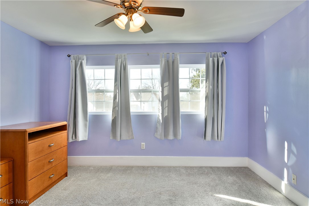 1525 Elm Road Northeast Warren, OH 44483 - Photo 31 of 50 Spare room featuring light carpet and ceiling fan