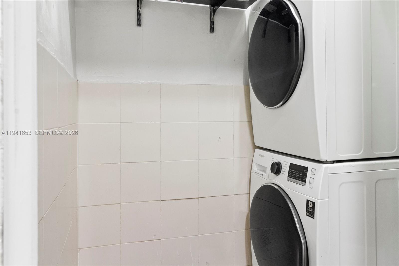 441 Northeast 30th Street, Unit 12 Pompano Beach, FL 33064 - Photo 19 of 33 a close up view of a washer and dryer