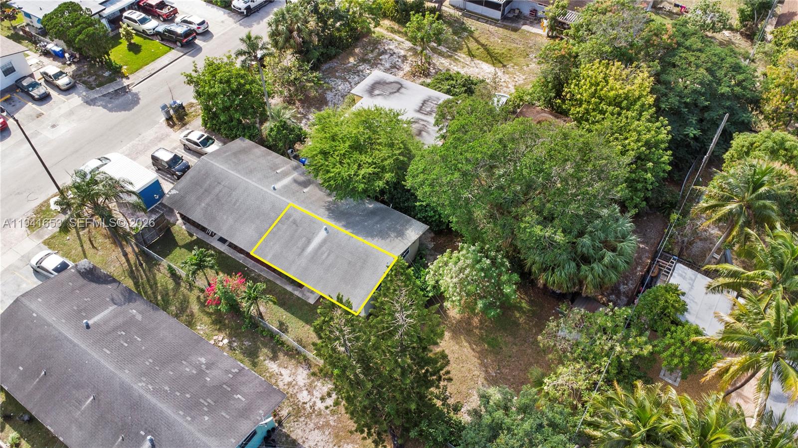 441 Northeast 30th Street, Unit 12 Pompano Beach, FL 33064 - Photo 29 of 33 an aerial view of a house with a yard and garden