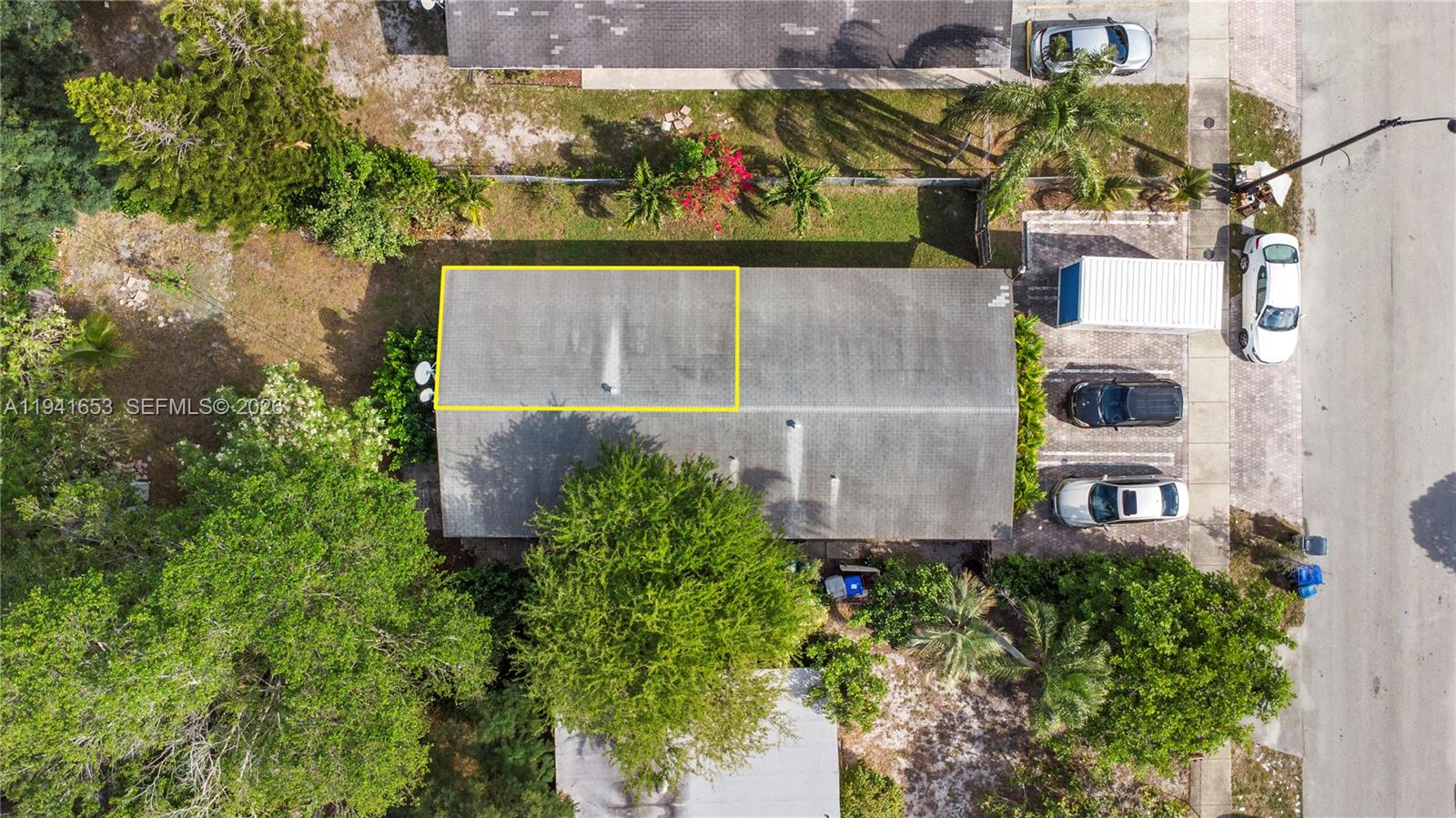 441 Northeast 30th Street, Unit 12 Pompano Beach, FL 33064 - Photo 31 of 33 an aerial view of a house with a yard and large trees