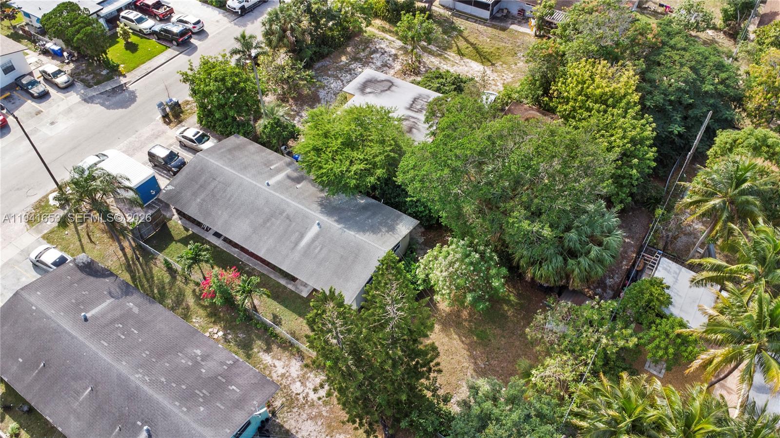 441 Northeast 30th Street, Unit 12 Pompano Beach, FL 33064 - Photo 33 of 33 an aerial view of a house with a yard and garden