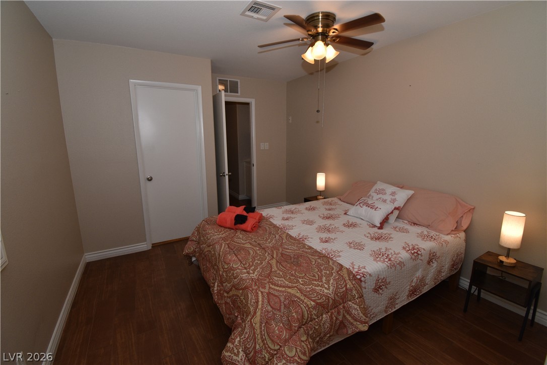 267 Westwind Road Henderson, NV 89074 - Photo 19 of 27 Floors and a ceiling fan create a comfortable atmosphere in this private bedroom.