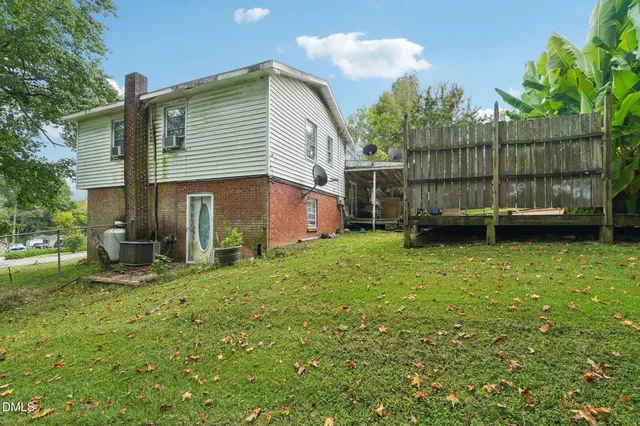 a view of backyard with deck