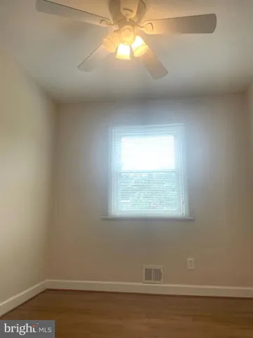 a view of a room that has a window in it