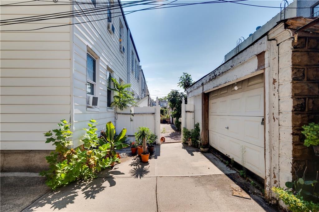 448 82nd Street Brooklyn, NY 11209 - Photo 2 of 2 a view of a house with a flower garden