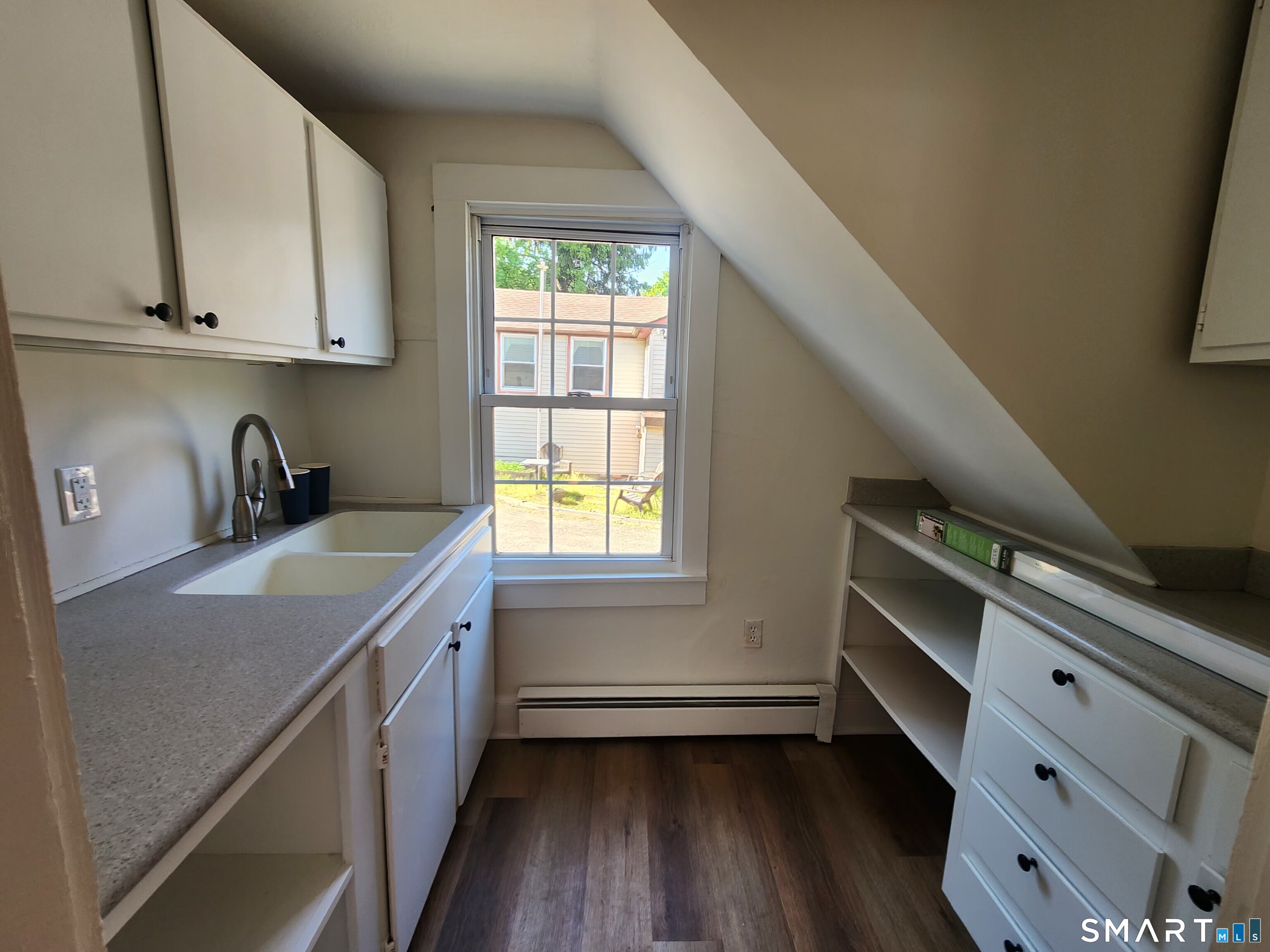 82 State Street, Unit 1 Guilford, CT 06437 - Photo 5 of 9 a room with storage and utility