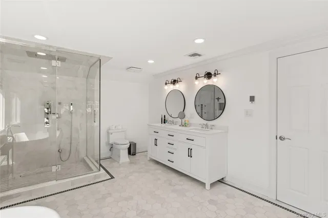 a view of a bathroom with mirror gate and bathroom