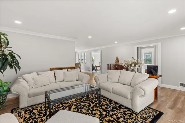 a living room with furniture and a rug