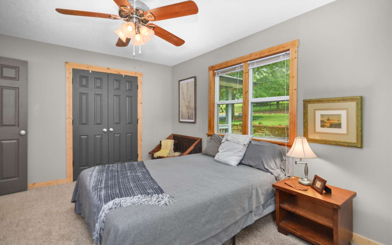 483 Parker Road Ellijay, GA 30536 - Photo 17 of 33 a bedroom with a bed and a chandelier