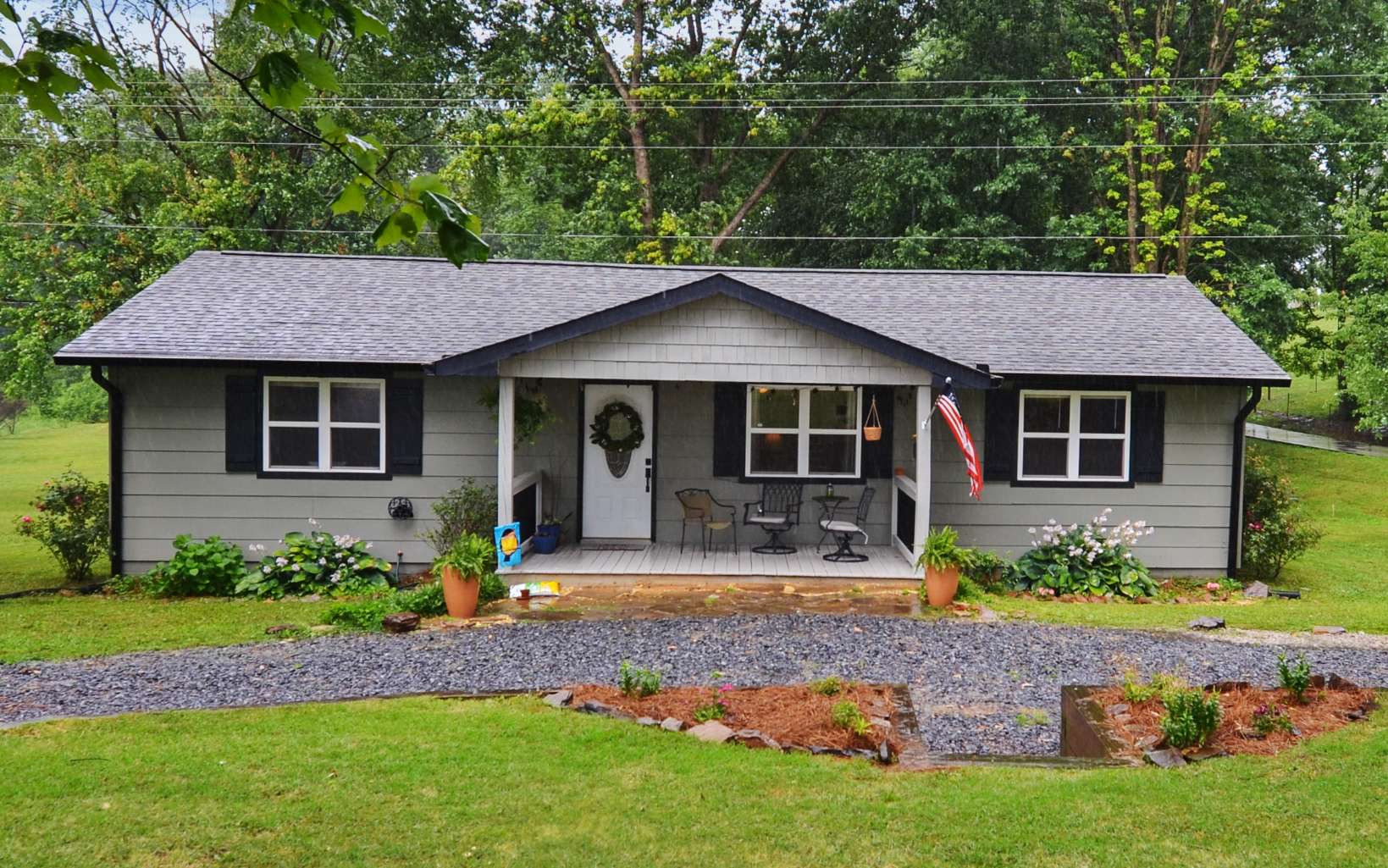 483 Parker Road Ellijay, GA 30536 - Photo 23 of 33 a front view of a house with a garden and yard